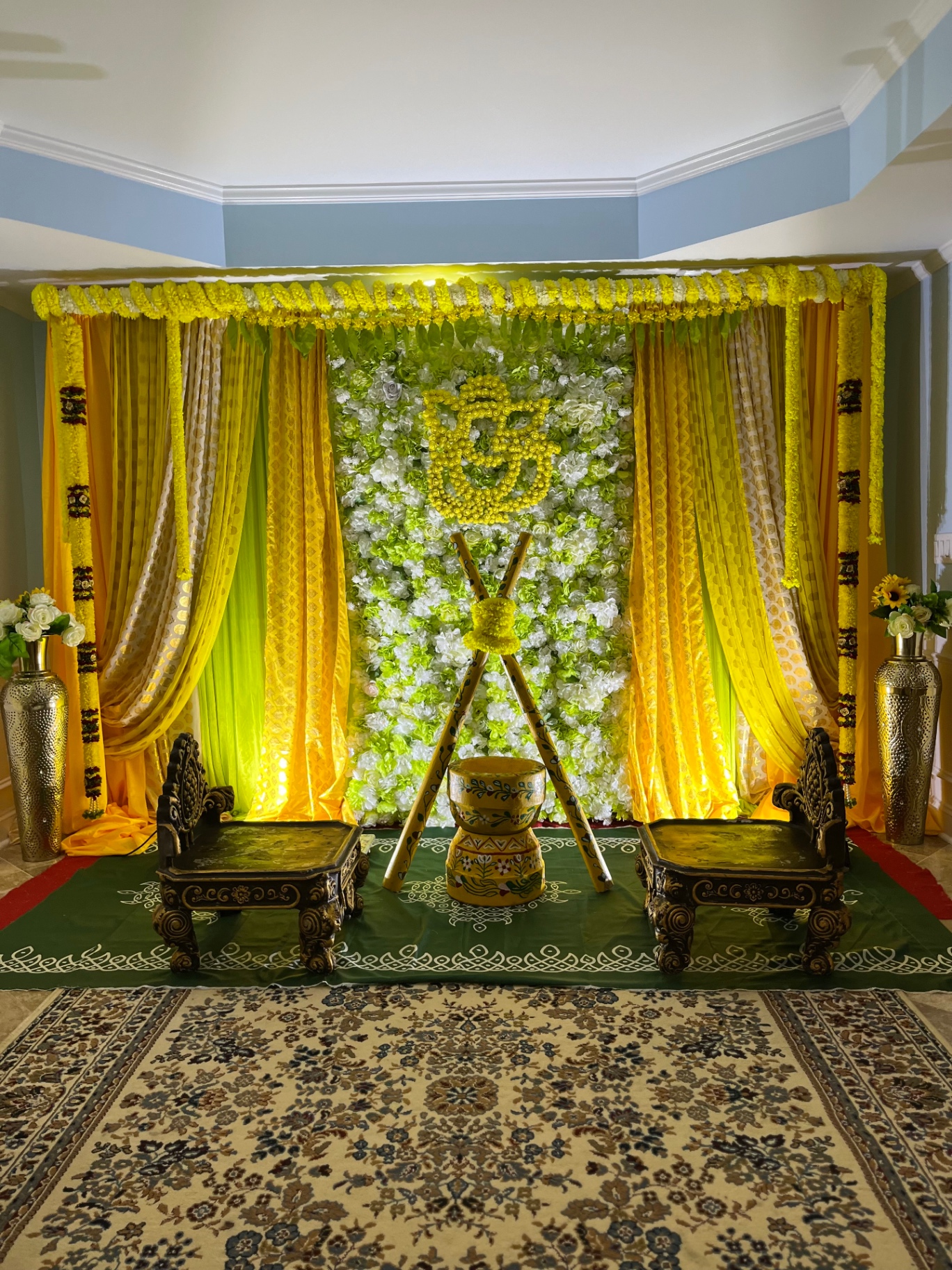 Yellow and green Om floral wall for Haldi