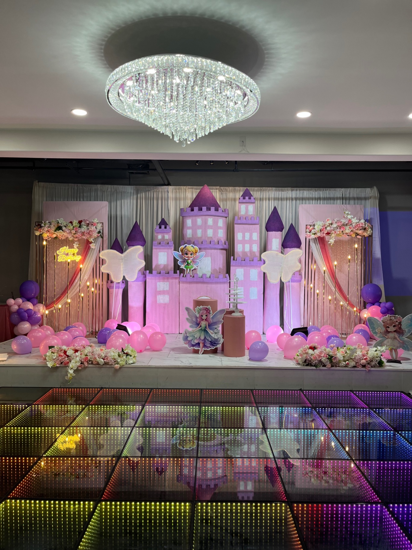 Pink fairy castle birthday stage with illuminated dance floor