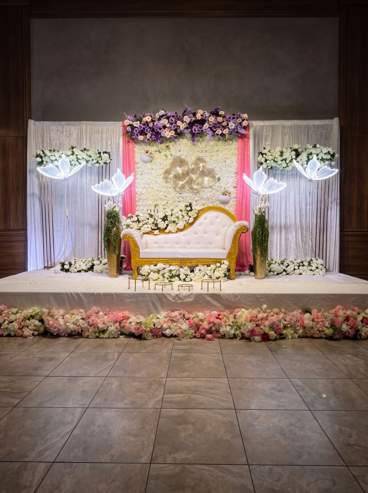 Pastel engagement backdrop and seating
