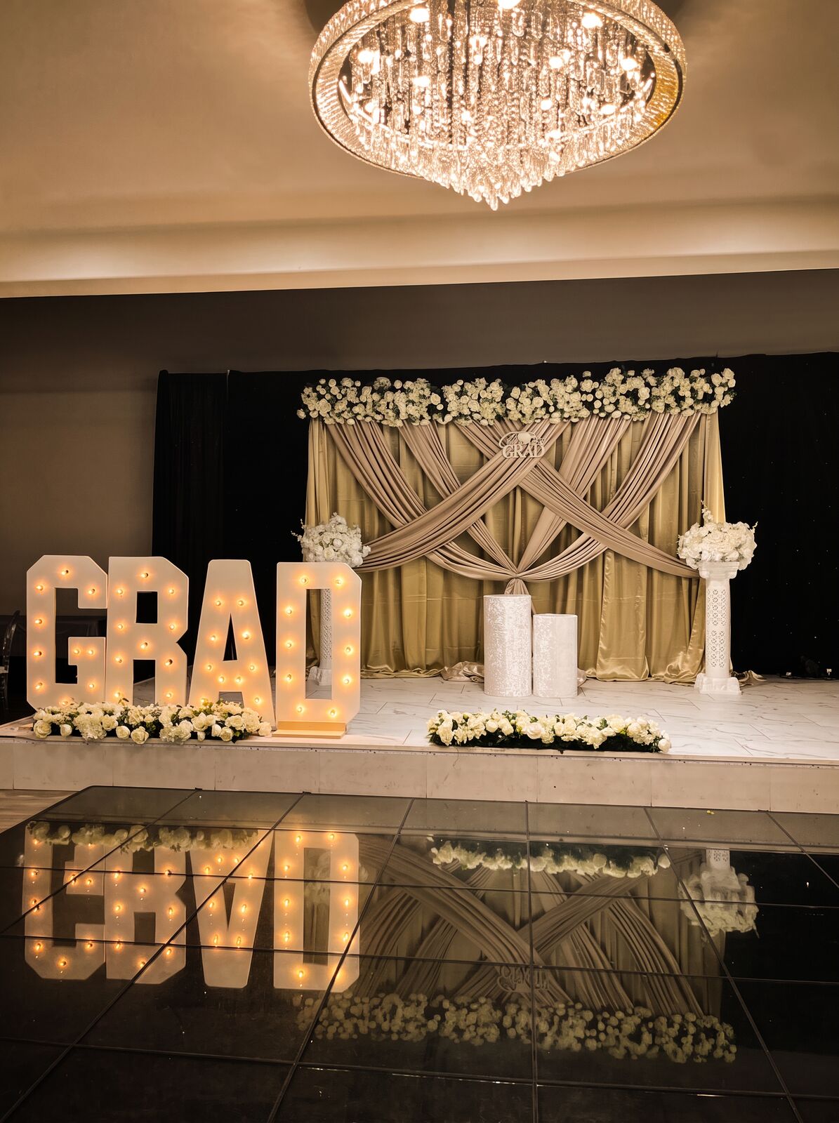 Graduation stage with champagne draping