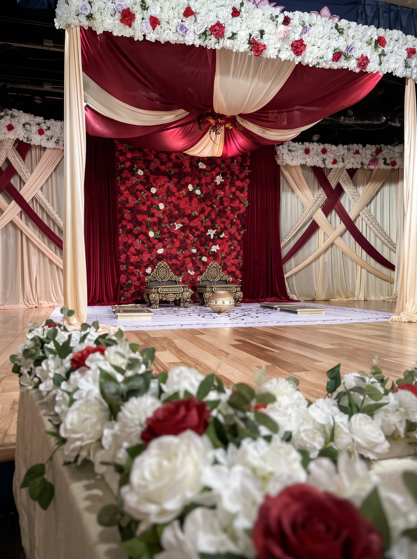 Blush wedding stage with floral canopy