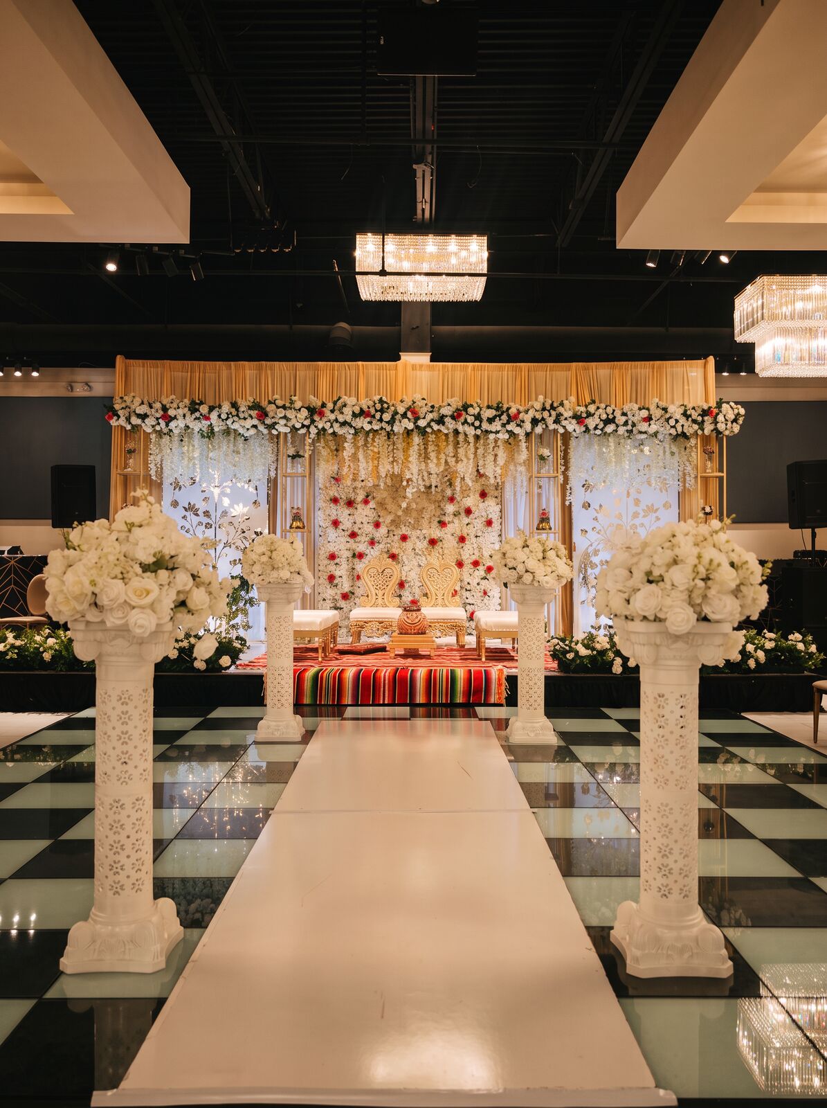 Wedding ceremony beneath a floral arch